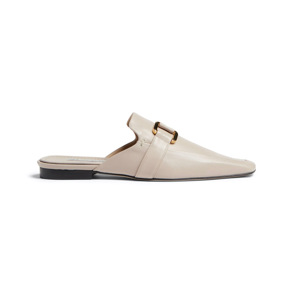 Neil J Rodgers off-white Andi backless loafer with an angled square toe, minimal stitching, and gold hardware detail in soft Italian nappa leather.
