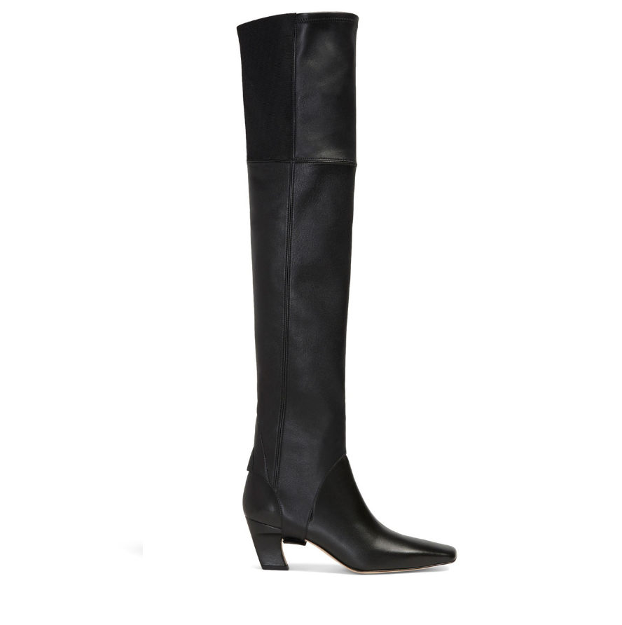 Neil J Rodgers Tik over the knee gaiter designed to be worn with the Tik ankle boot is a stirrup style that attaches over the sole next to the heel. Made of black Italian stretch nappa leather and an elasticized band, the gaiter fits over the knee.
