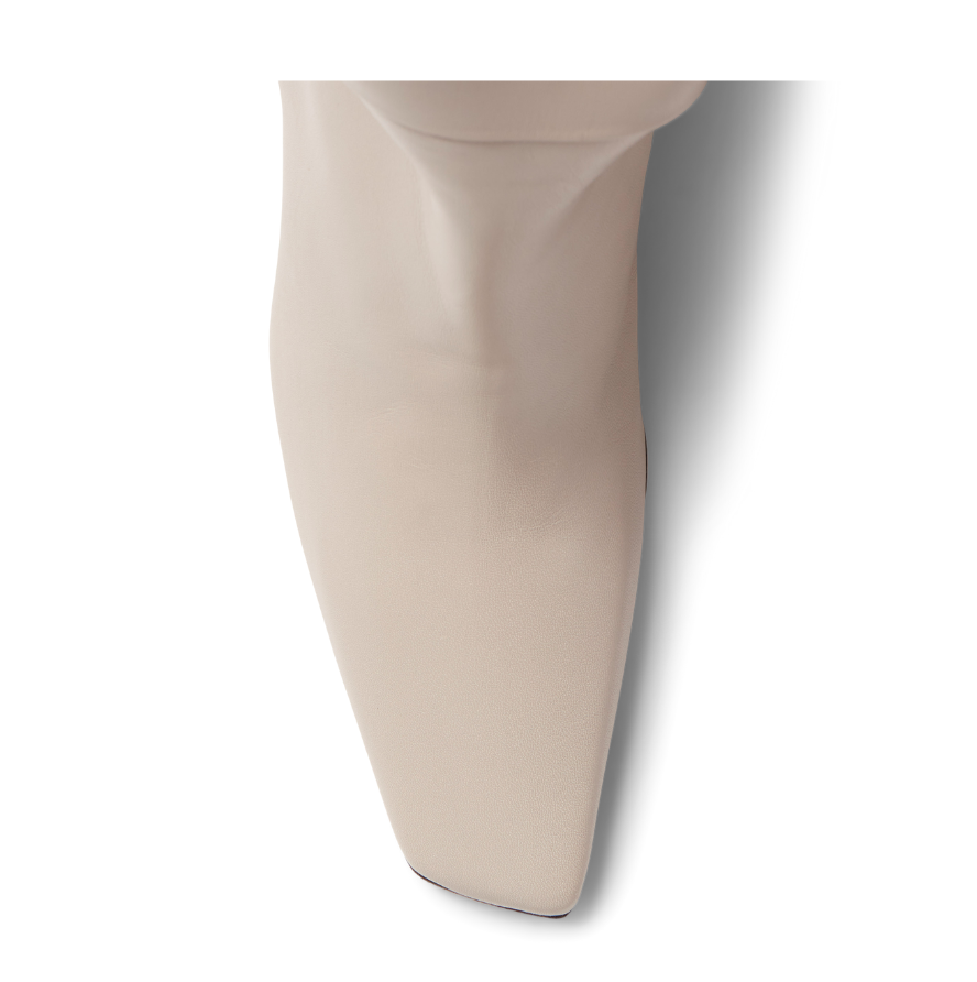 Neil J Rodgers Meg knee high boots with a pointed square toe made from soft, off-white Italian nappa leather.