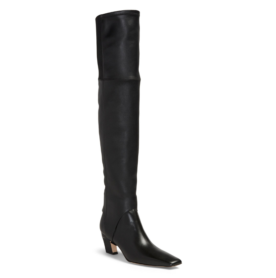 Neil J Rodgers Tik over the knee gaiter designed to be worn with the Tik ankle boot is a stirrup style that attaches over the sole next to the heel. Made of black Italian stretch nappa leather and an elasticized band, the gaiter fits over the knee.