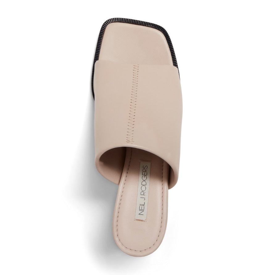 Neil J Rodgers Sue Mule in off white nappa leather has an exaggerated square toe, wide stretch nappa instep strap, padded footbed, and 60mm heel.