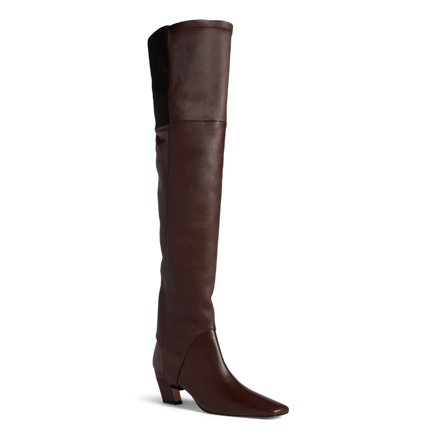 Neil J Rodgers Tik over the knee gaiter designed to be worn with the Tik ankle boot is a stirrup style that attaches over the sole next to the heel. Made of bruciato Italian stretch nappa leather and an elasticized band, the gaiter fits over the knee.
